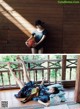 A woman laying on a wooden floor holding a basketball.